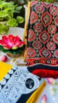 ​🎈 Boho Chic: Bold Red Ikkat Saree with Playful Pom-Poms 🖤